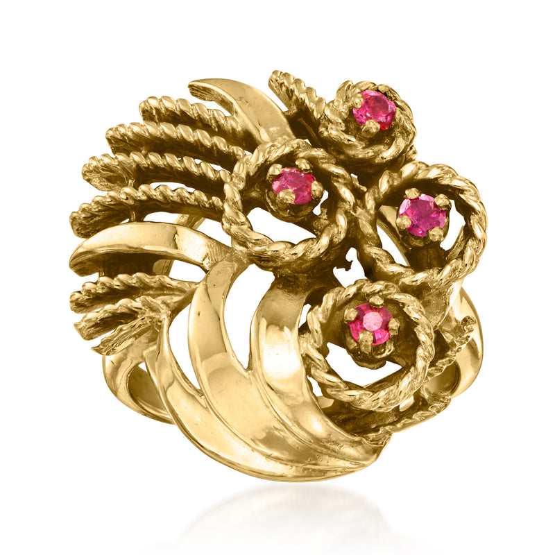 Vintage 14kt yellow gold ring with four pink ruby-style stones in a curled setting
