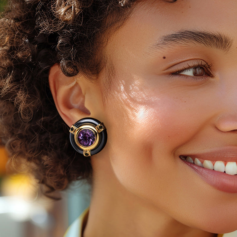Purple amethyst earrings with yellow gold bezel, dark gray halo and green stone accents