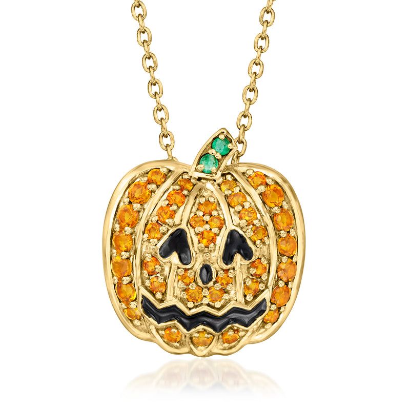 Gold jack-o'-lantern pendant necklace with round orange stone face, black enamel, green accents