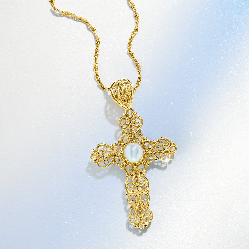 Gold filigree cross pendant necklace with mother-of-pearl center and scroll details