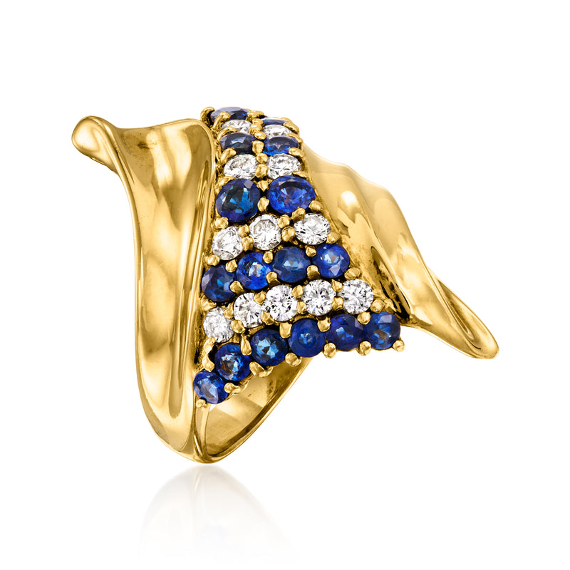 Swirl sapphire and diamond ring in 18kt yellow gold with blue stone cluster