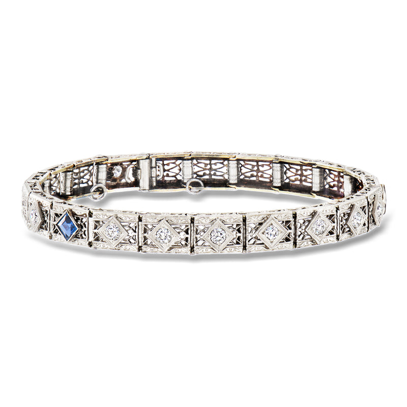 Vintage white gold filigree bracelet with clear stones and blue accent center details
