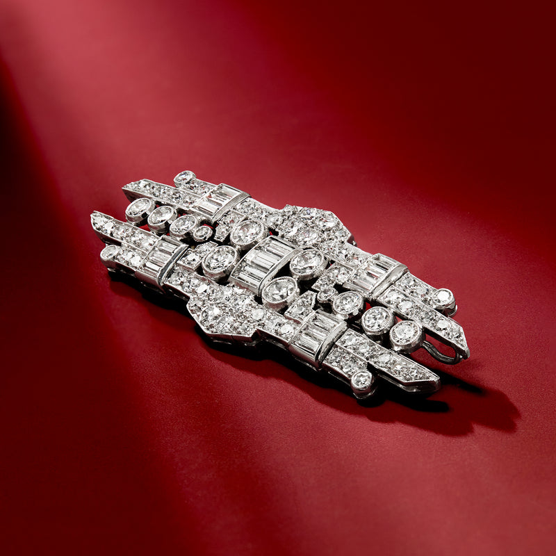 Platinum vintage diamond pin with baguette and round stones, bar-and-basket setting