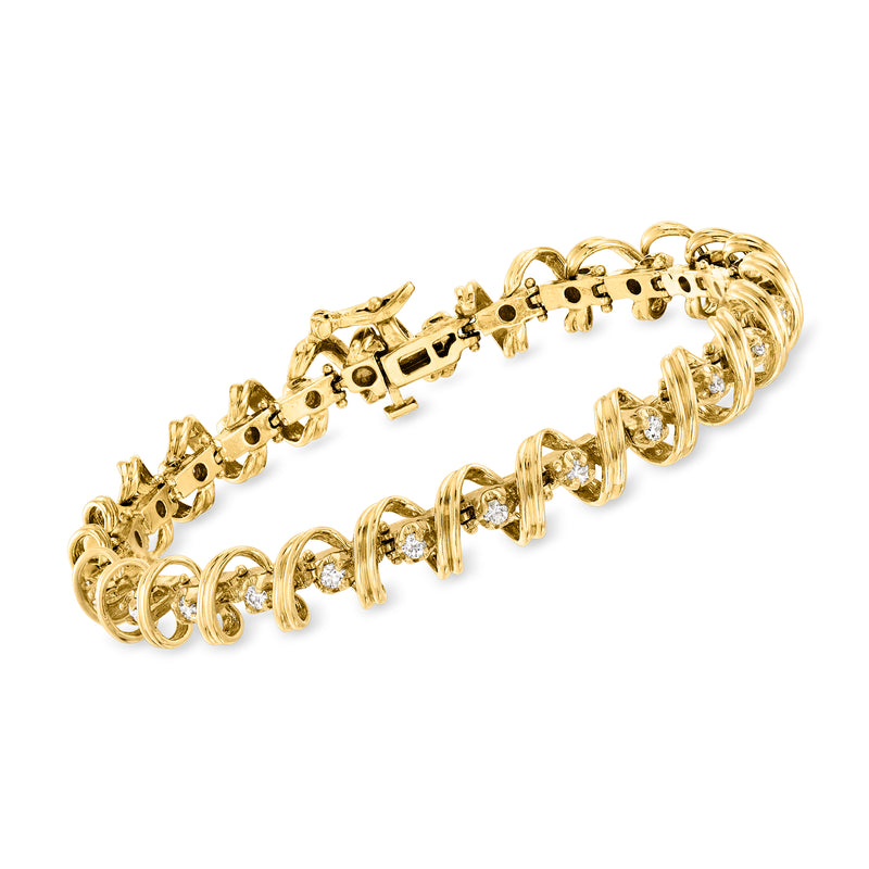 14kt yellow gold diamond spiral bracelet with round bezel-set stones, hinged links