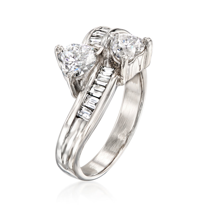 Platinum bypass ring with three large round diamonds and baguette-cut accents