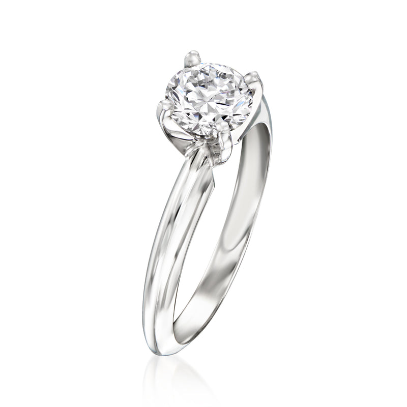 White gold diamond solitaire ring with round center stone and side setting