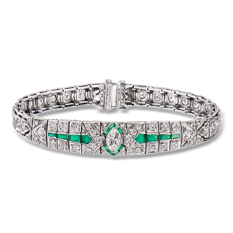 Platinum-toned vintage diamond bracelet with simulated emerald green accents and clasp
