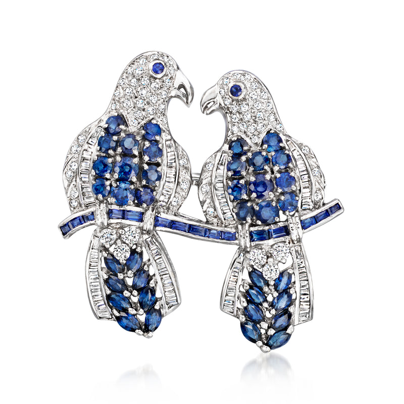 Two-bird pin with sapphire-blue stones and white diamonds in white gold setting