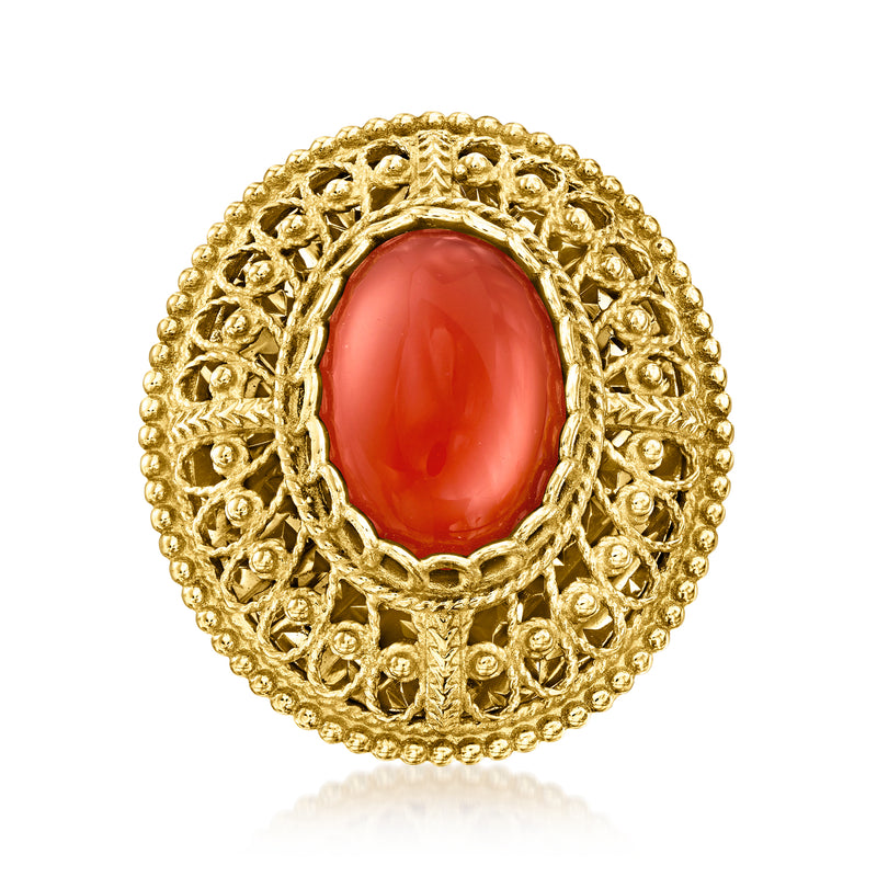 Gold filigree ring with oval red gemstone bezel and openwork band