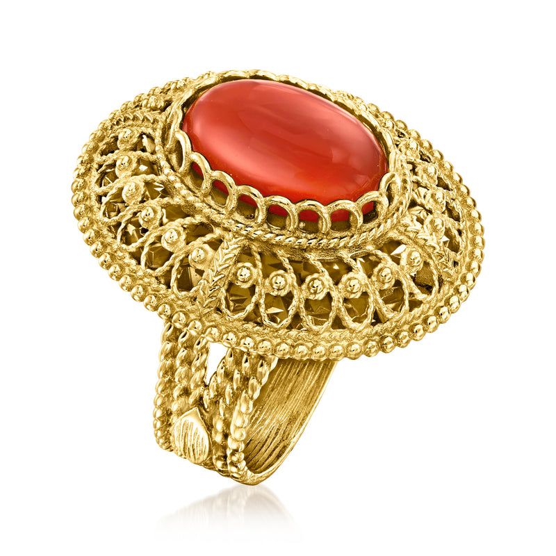 Gold filigree ring, side view, with oval red gemstone and scalloped openwork crown