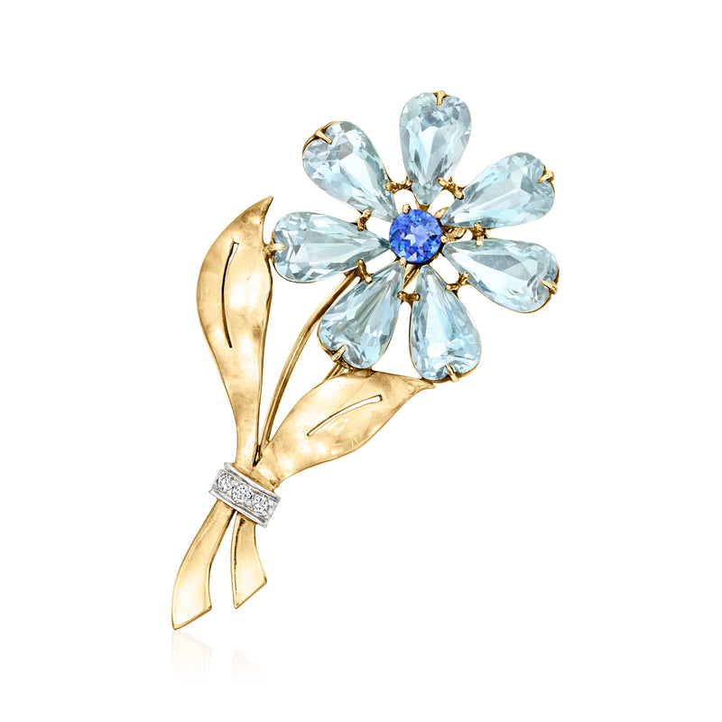 Vintage aquamarine flower pin with sapphire center and diamond accents in gold