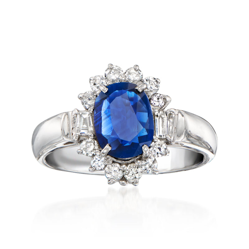 18kt white gold sapphire and diamond cluster ring with blue oval center stone