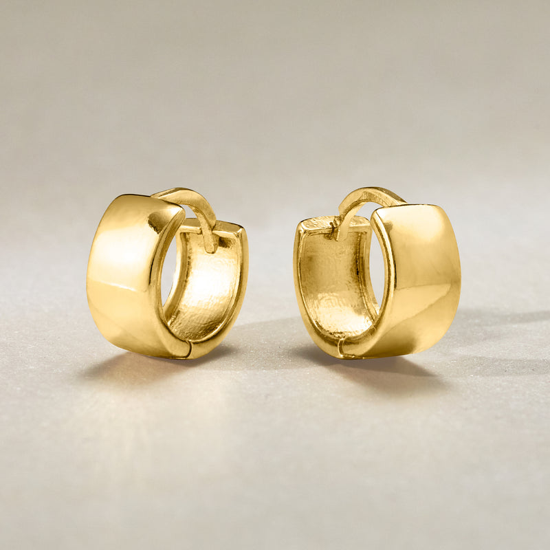 Gold-tone huggie hoop earrings, side view of hinged clasp mechanism