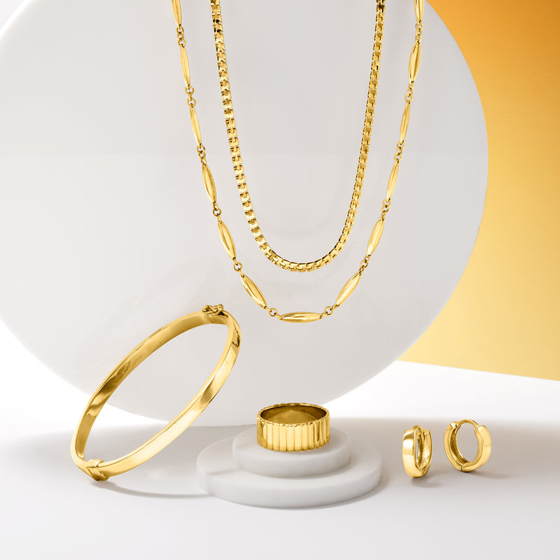 Gold-tone polished bangle bracelet with open ends and hinge clasp