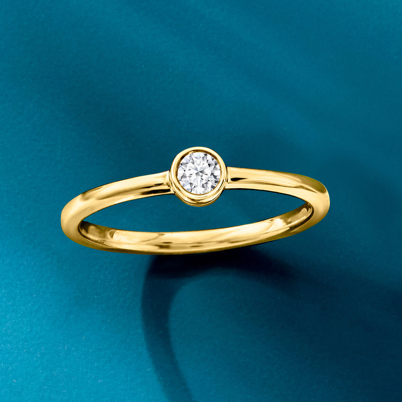 Round bezel-set lab-grown diamond solitaire ring in 14kt yellow gold, angled view