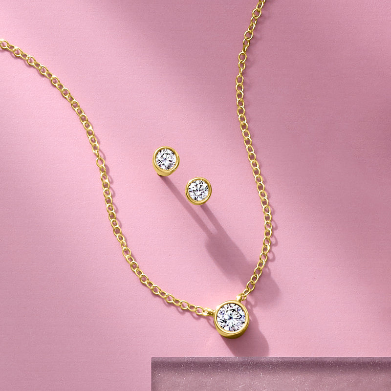 Round diamond stud earrings in 14kt yellow gold bezel settings, post backs