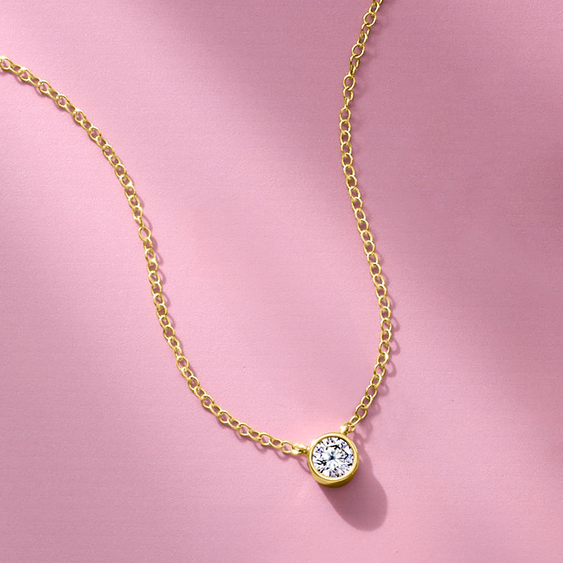Yellow gold chain necklace with round bezel-set diamond solitaire pendant
