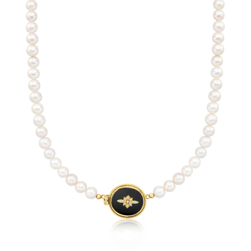 Cultured pearl necklace with dark onyx oval pendant and gold star-shaped detail