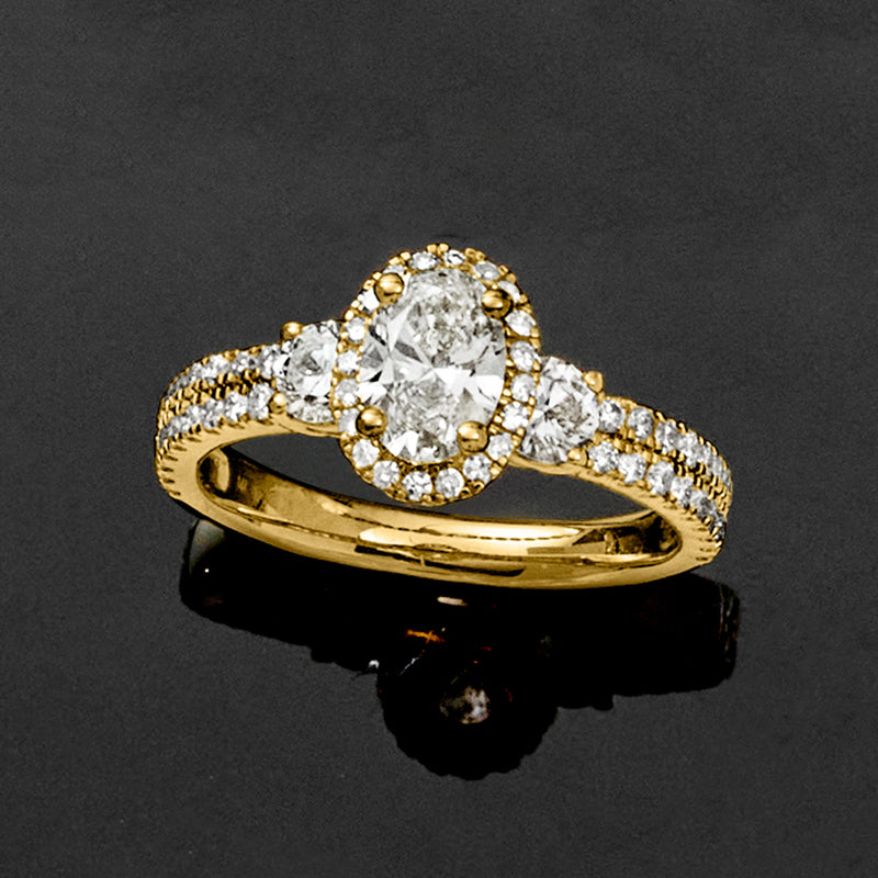 14kt yellow gold lab-grown diamond ring with oval center stone and pavé band