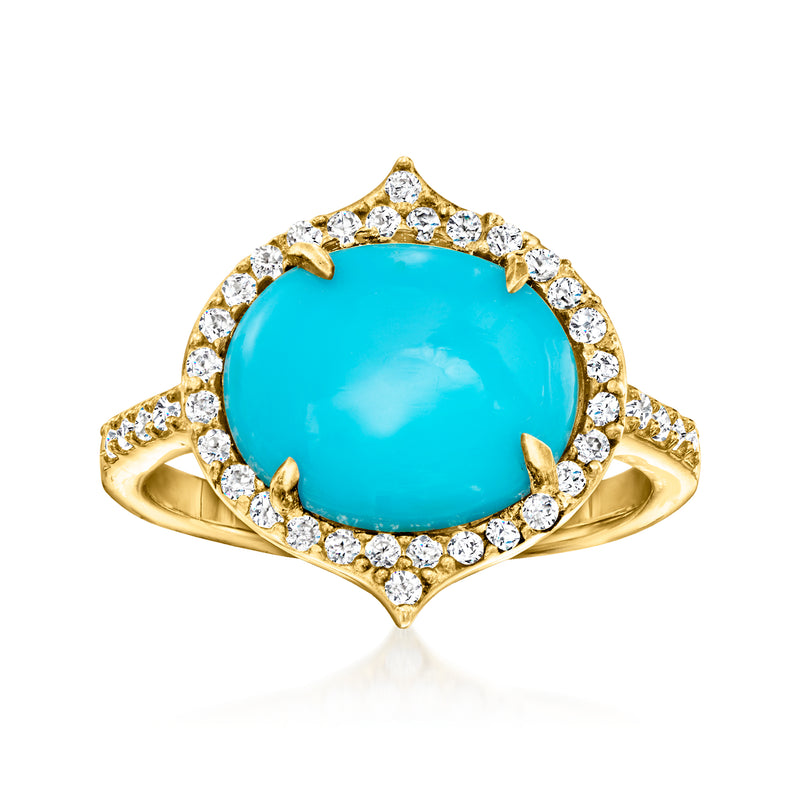 Gold ring with oval turquoise center, white zircon halo, openwork side accents