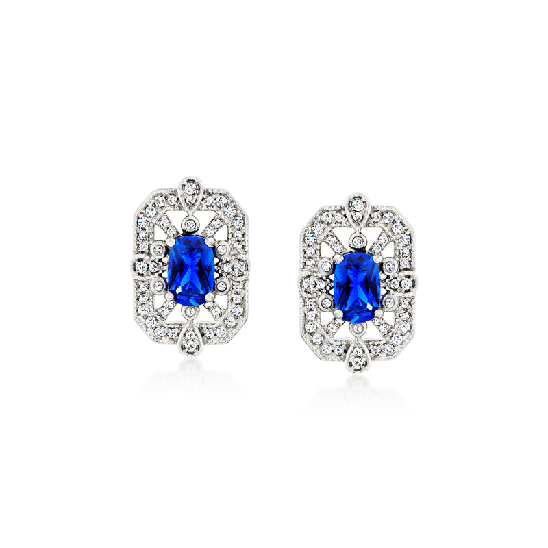 Sterling silver stud earrings with oval blue center stone and sparkling CZ halo