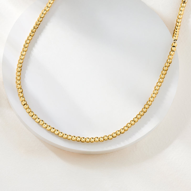 Gold 3mm bead necklace with rounded bead chain, close-up view