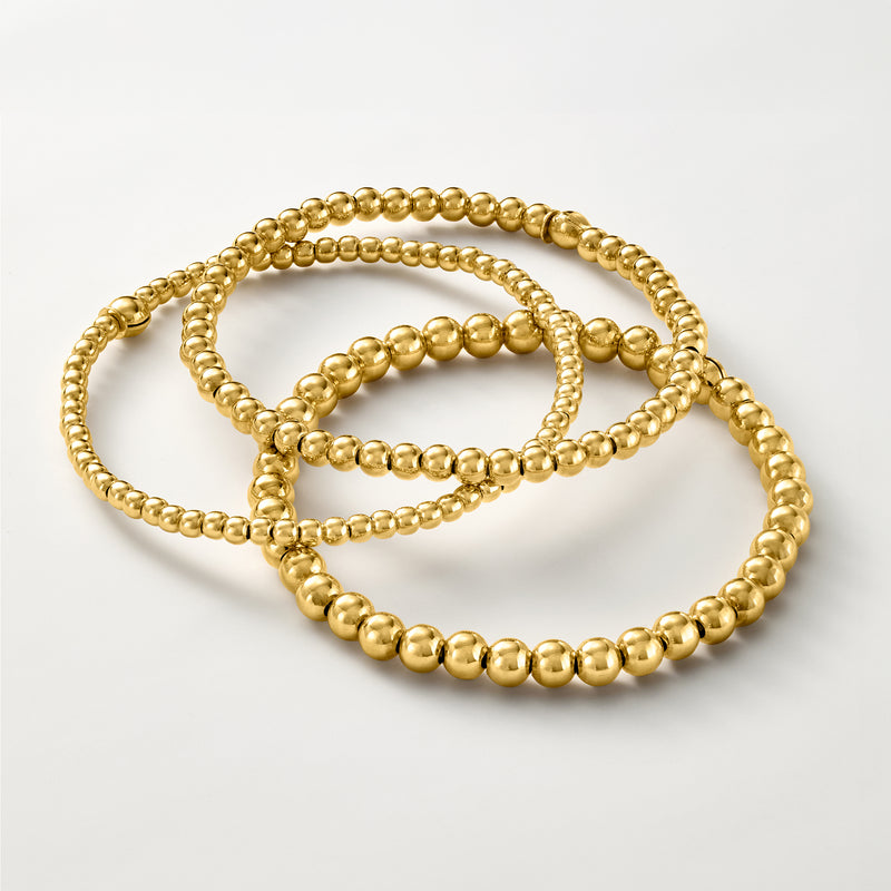 Gold-tone bead stretch bracelet set with three strands of round beads