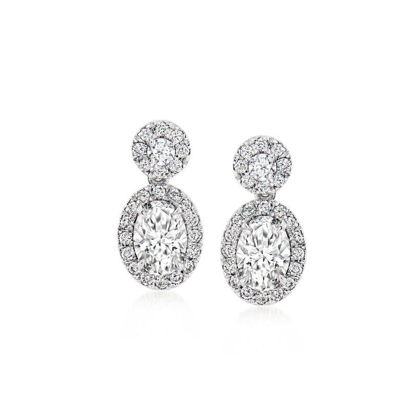 Double-drop diamond earrings in 14kt white gold, round top halo and oval drop