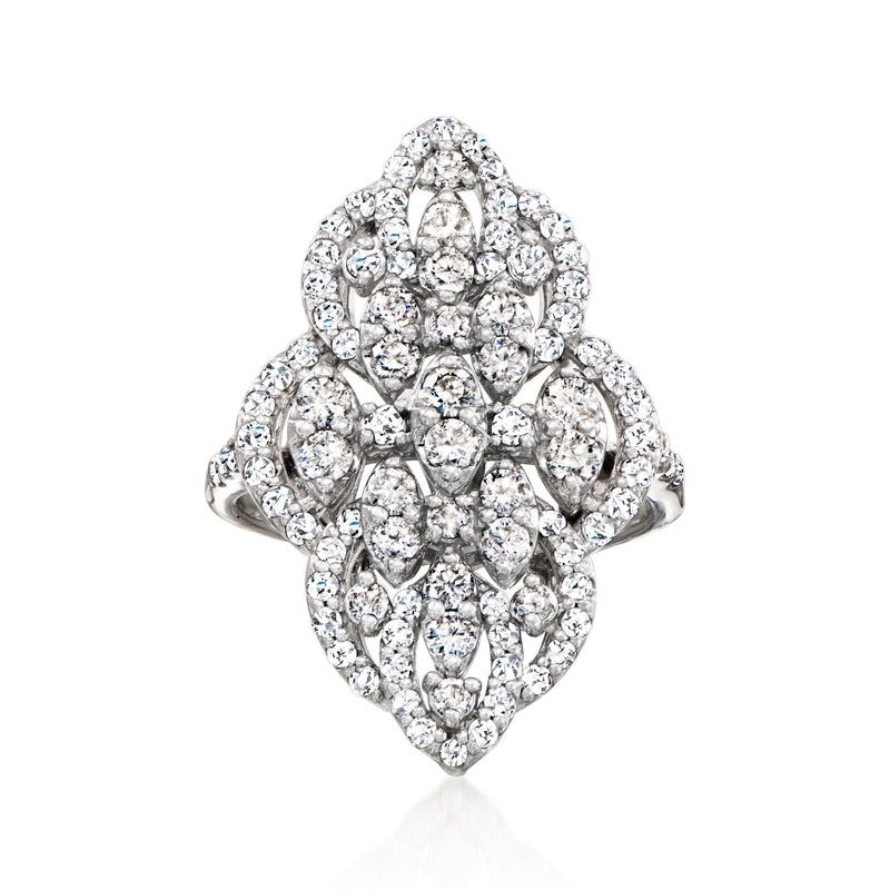 Vintage diamond cluster ring in white gold with oval halo of small round diamonds