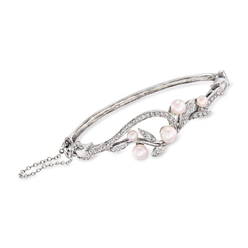 Vintage white gold bangle bracelet with swirl diamonds and pink cultured pearls