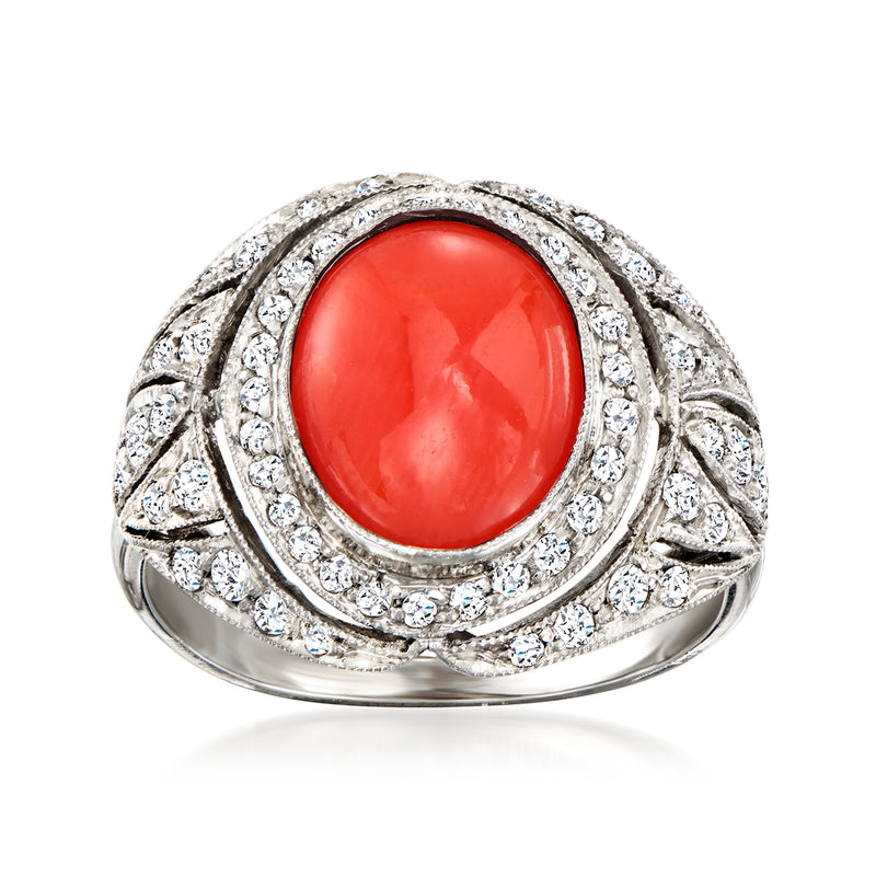 Vintage coral and diamond ring in platinum with oval red coral center