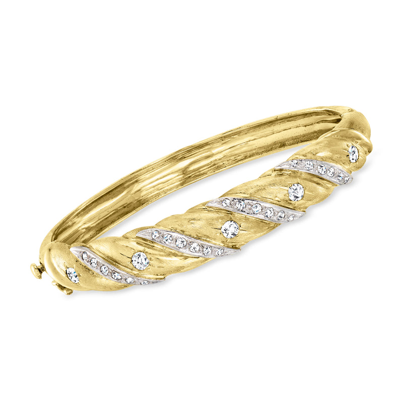Twisted 14kt yellow gold diamond bangle with row of small round stones
