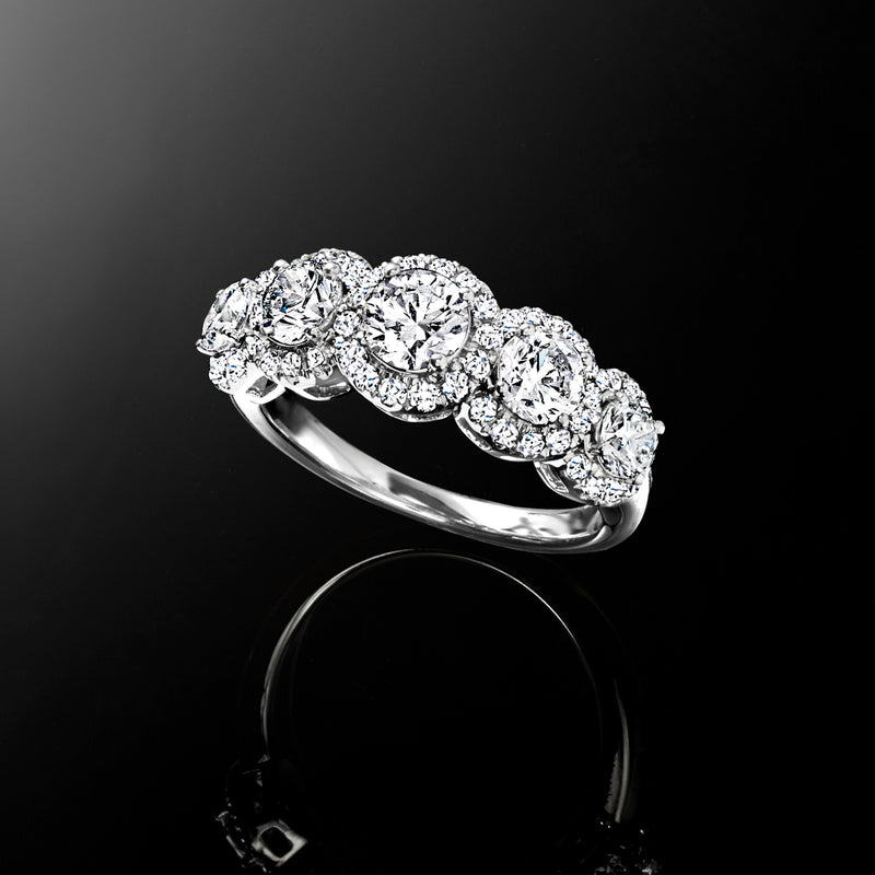 Five-stone diamond ring in white gold, diagonal view of oval and round stones