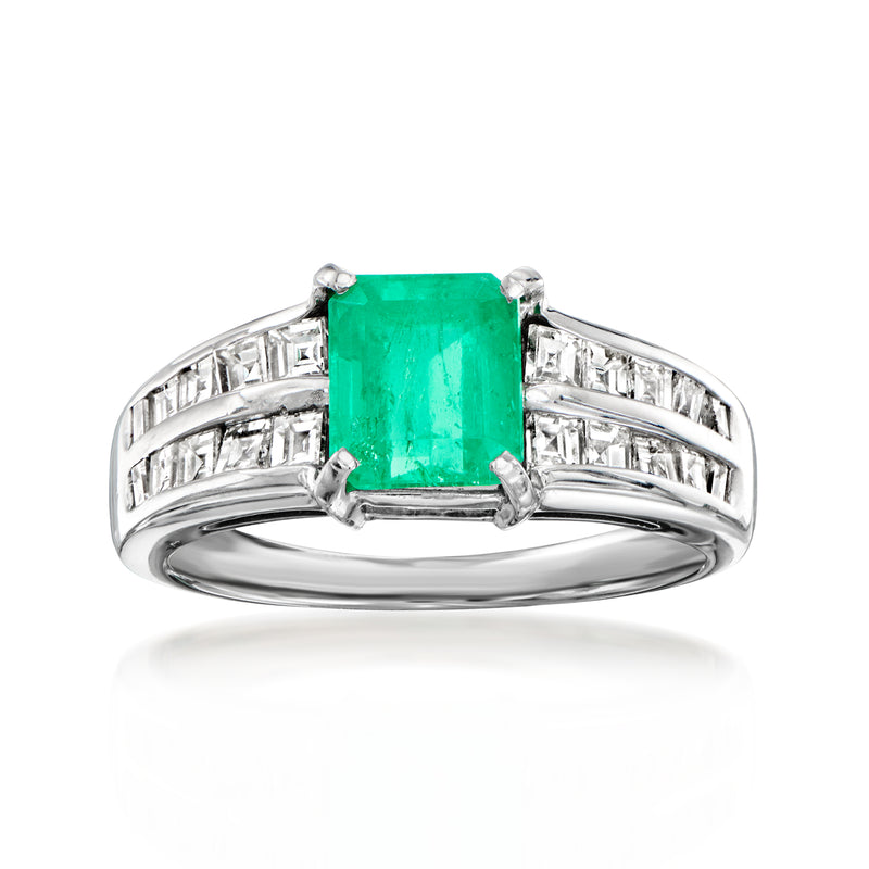 Platinum vintage-style emerald-cut gemstone ring with green center stone and baguette diamonds