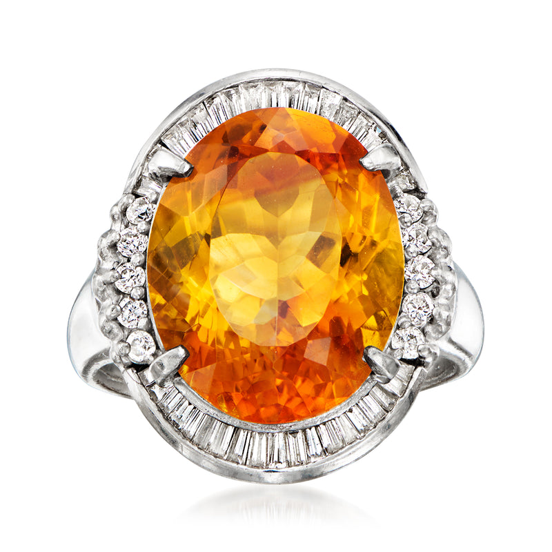 Oval citrine gemstone halo ring in platinum with diamond accents