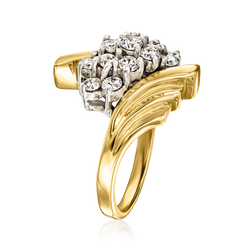 Yellow gold diamond cluster ring with round diamonds on raised bar, prong set