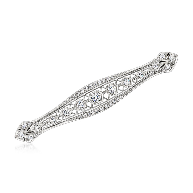 Platinum bar pin with filigree lattice and round diamonds, vintage-style.