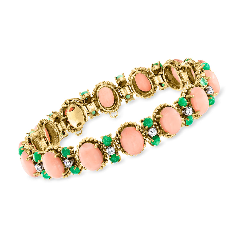 14kt yellow gold coral oval bracelet with emerald accents and diamond highlights