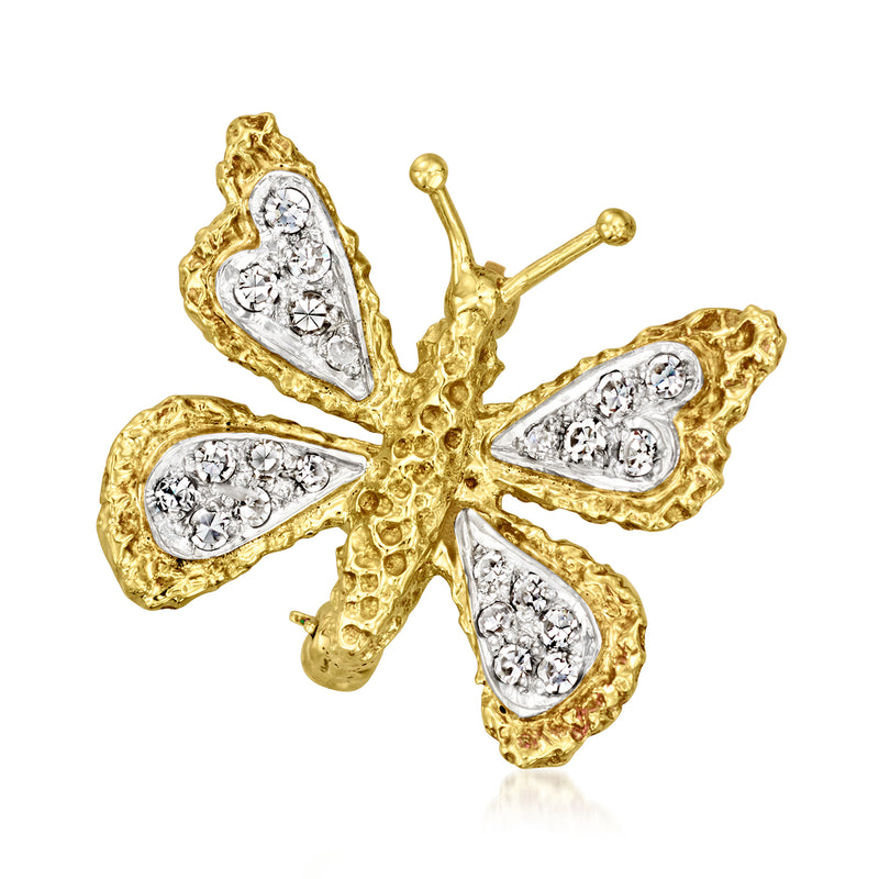 Two-tone gold diamond butterfly pin with pear and round stone accents