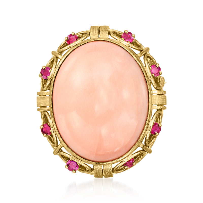 Oval pink coral pin with ruby bezel accents in 18kt yellow gold, vintage-style wreath