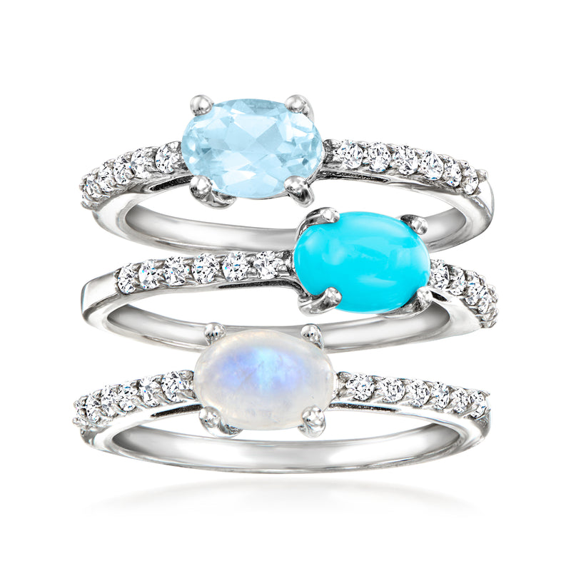 Three sterling silver rings with blue, turquoise, and opal gemstones