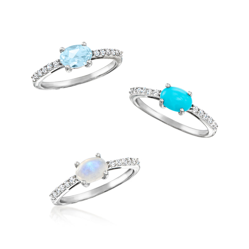 Three sterling silver rings with blue, turquoise, and opal-like gemstones