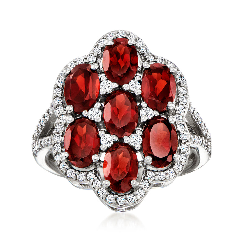 Sterling silver ring with red oval garnets and clear zircon accents