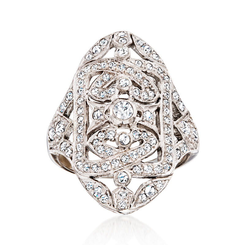 Vintage 18kt white gold openwork diamond ring, oval top with intricate filigree and stones.