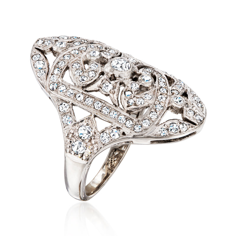 18kt white gold openwork diamond ring with teardrop-oval setting and prong-set round stones.