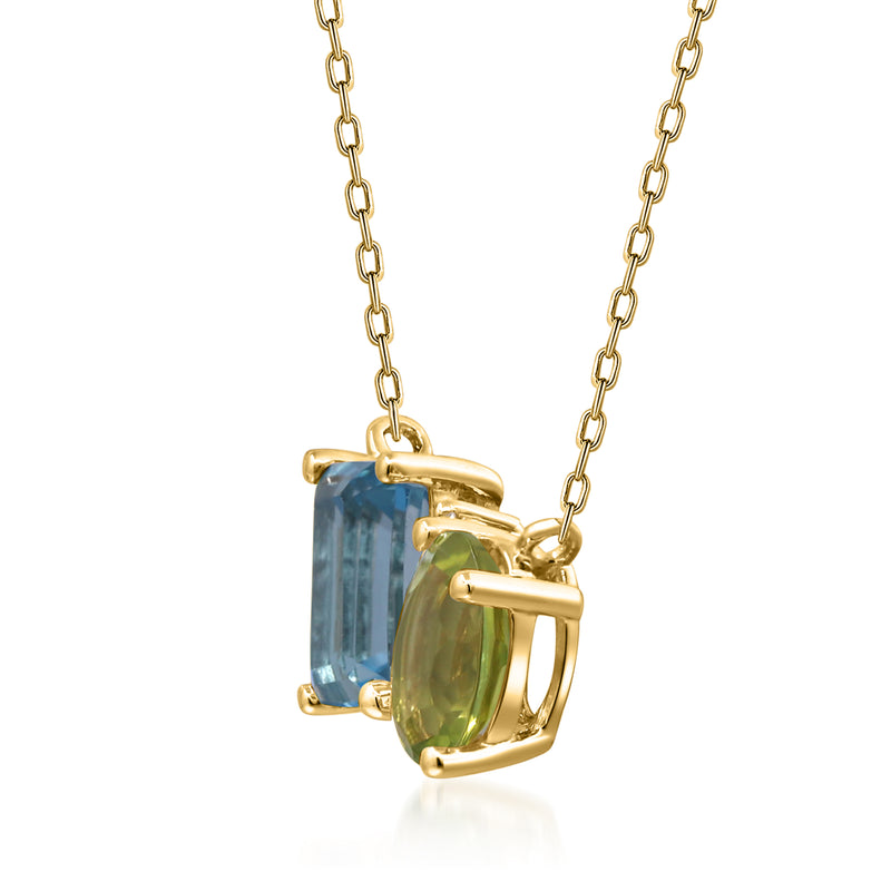 14kt yellow gold toi et moi necklace side view with blue topaz and green peridot bezels
