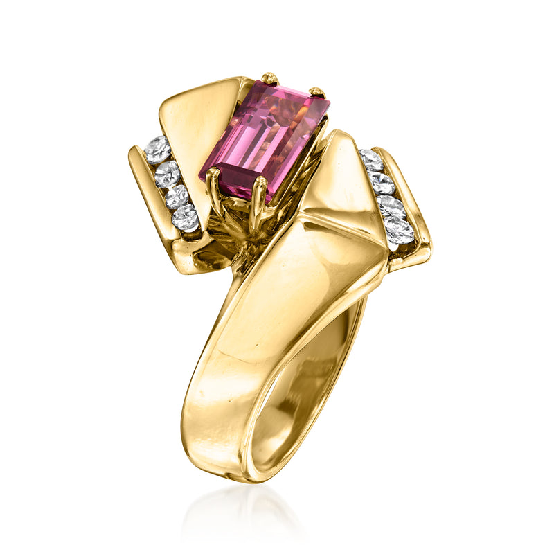 Yellow gold geometric ring with pink rectangular rhodolite garnet, flanked by round diamonds