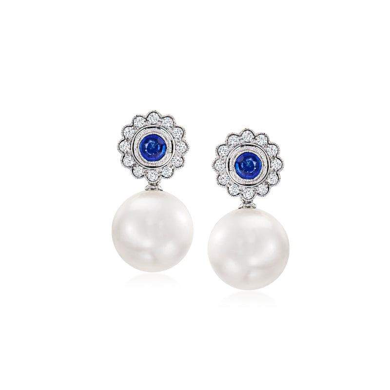 White gold drop earrings with blue sapphire, diamond halo, and white cultured pearl