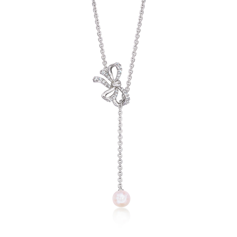 Sterling silver bow lariat necklace with diamond accents and pink cultured pearl drop