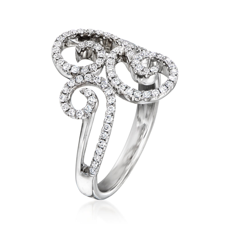 White gold diamond swirl ring with raised scroll setting and openwork